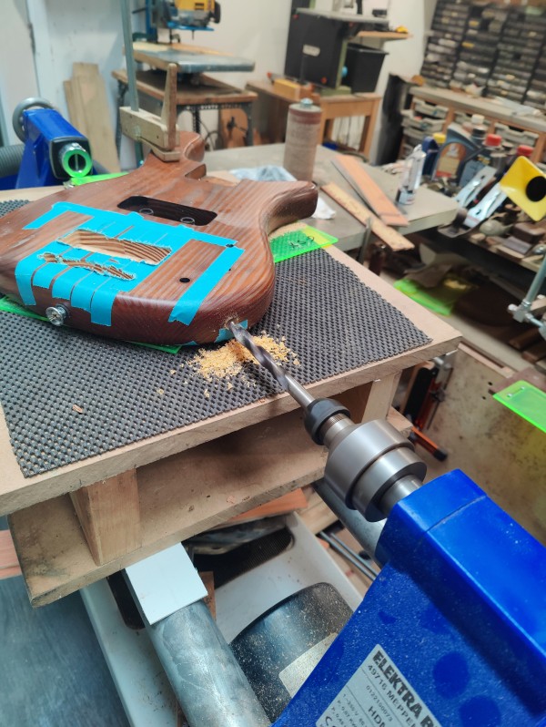 A stack of mahogany neck blanks await machining